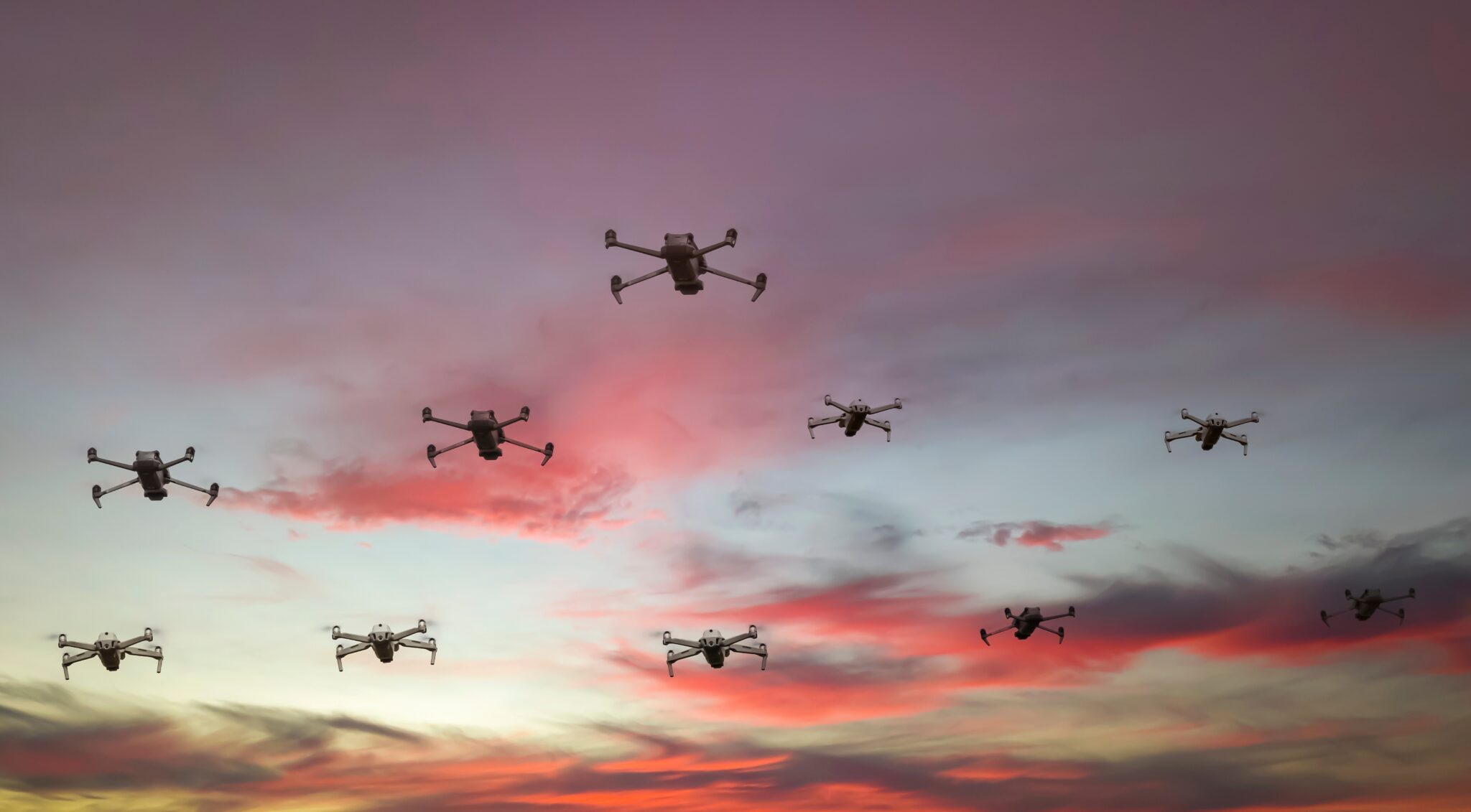 Group,Of,Surveillance,Drones,In,Front,With,Sunset,Sky,Scene